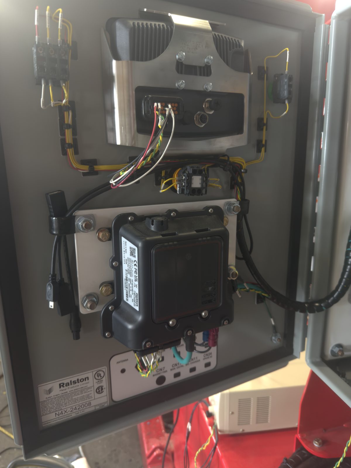 Telematics unit installed in a control enclosure